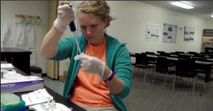 Rachel Lane testing samples she collected in the field at The Wilds.