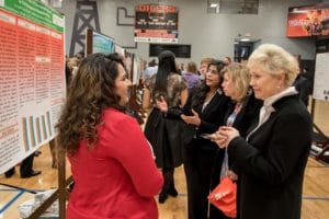 University of Findlay President Katherine Fell, Ph.D., right, talks with a poster presentation student at the 2016 Symposium for Scholarship and Creativity.