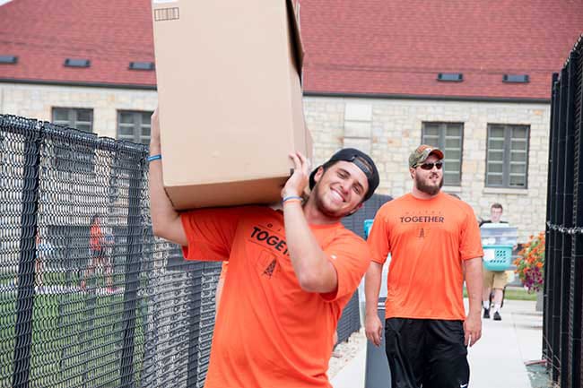 Oilers moving in to on-campus housing with boxes