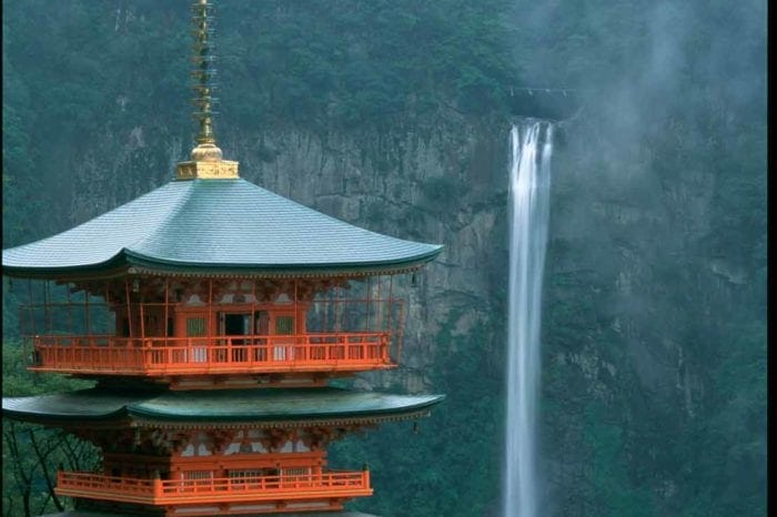 waterfall in Japan behind beautiful Japanese architecture