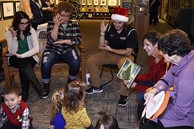 EJ Emmons signs with ASL classmates at a Mazza Museum Funday Sunday.