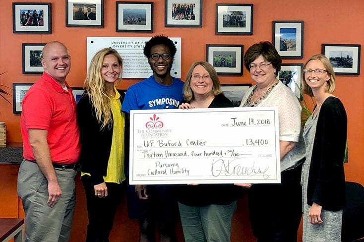 The Community Foundation presents the UF Buford Center with a check of $13,400