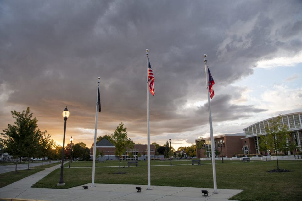 American, Ohio, and UF flags in front of the CBSL building