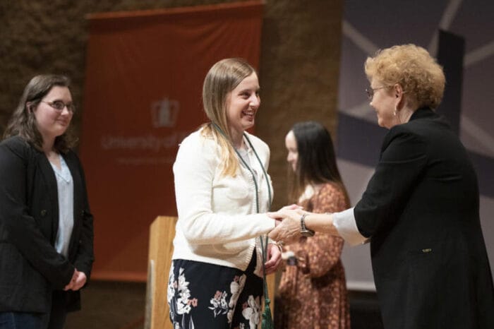 Dr. Fell handing out cords