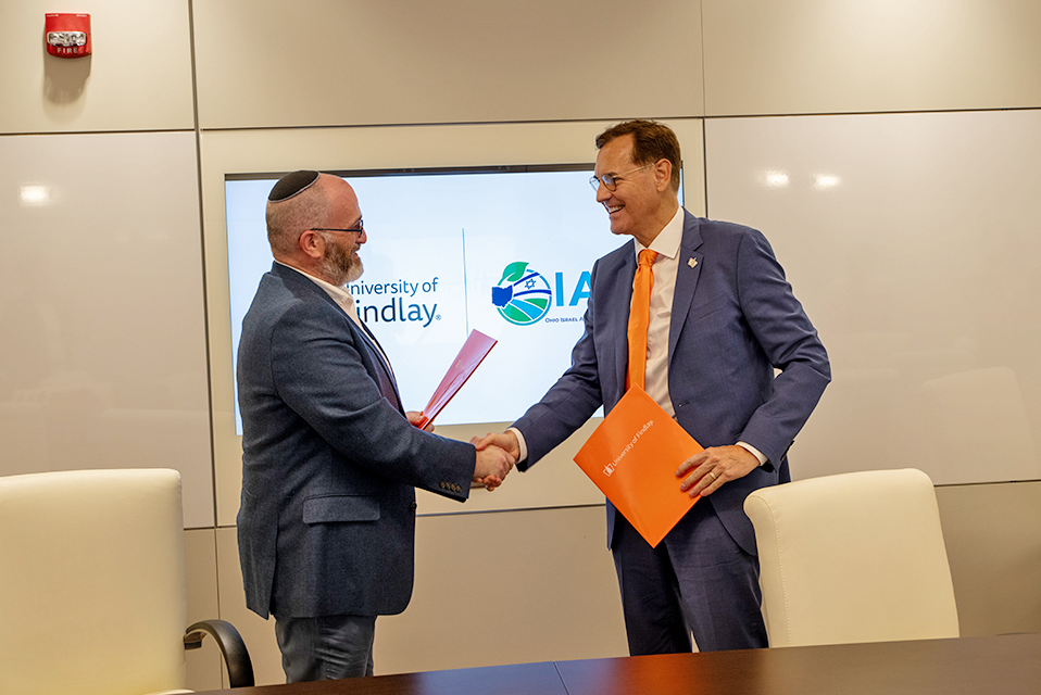Alain de Wolff, director of the Ohio-Israel Ag and CleanTech Initiative, shakes hands with UF President Richard L. Ludwick, JD, DEd.
